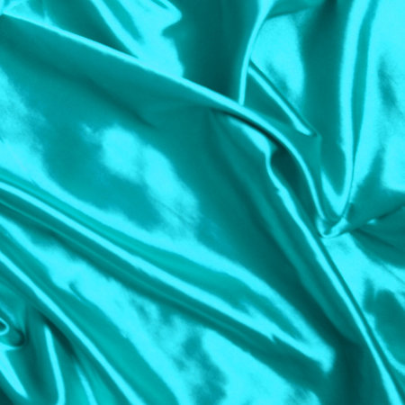 Smooth elegant turquoise silk backgroundの写真素材