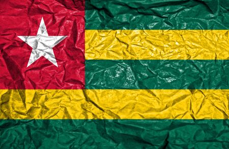 Togo vintage flag on old crumpled paper backgroundの写真素材
