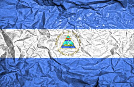 Nicaragua vintage flag on old crumpled paper backgroundの写真素材