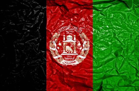 Afghanistan vintage flag on old crumpled paper backgroundの写真素材