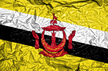 Brunei vintage flag on old crumpled paper backgroundの写真素材