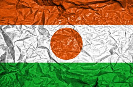 Niger vintage flag on old crumpled paper backgroundの写真素材