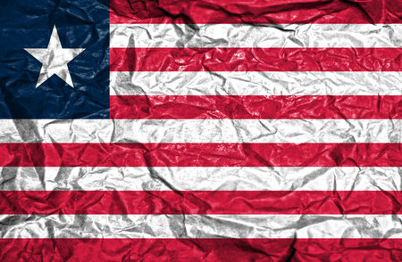 Liberia vintage flag on old crumpled paper backgroundの写真素材