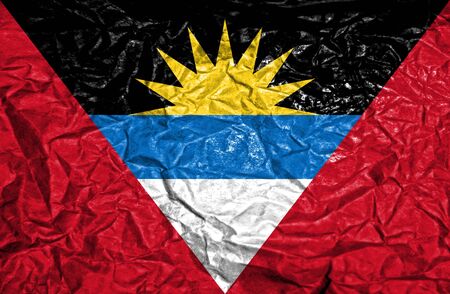 Antigua and Barbuda vintage flag on old crumpled paper backgroundの写真素材