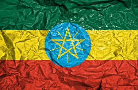 Ethiopia vintage flag on old crumpled paper backgroundの写真素材