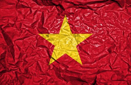 Vietnam vintage flag on old crumpled paper backgroundの写真素材