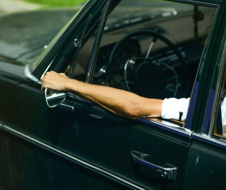 Man driving car and enjoying his ride