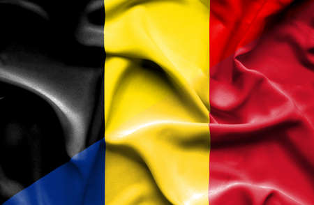 Waving flag of Romania and Belgiumの写真素材