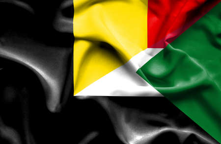Waving flag of Sudan and Belgiumの写真素材
