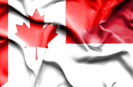 Waving flag of Monaco and Canadaの写真素材
