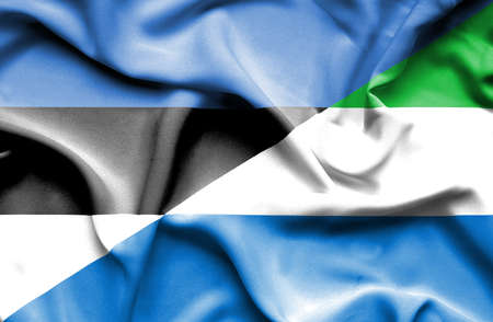 Waving flag of Sierra Leone and Estoniaの写真素材