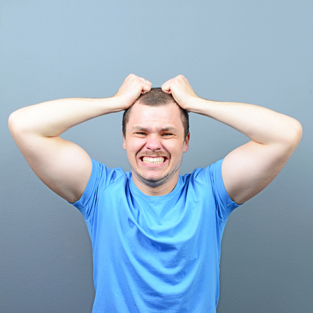 Portrait of a man suffering from headacheの写真素材