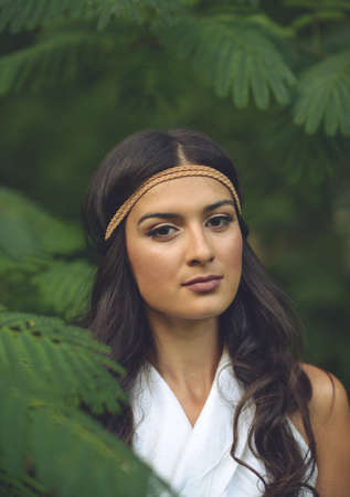 Portrait of beautiful young woman in natureの写真素材