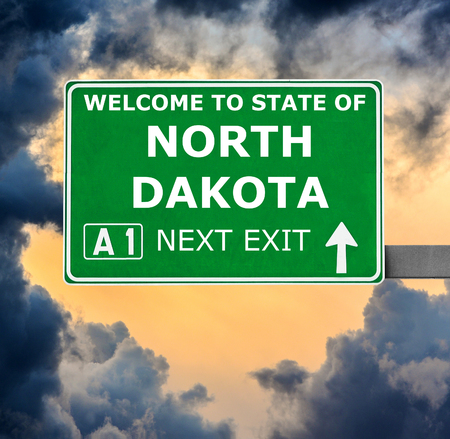 NORTH DAKOTA road sign against clear blue skyの写真素材