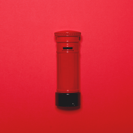 Retro post box on red background - Top view minimal designの写真素材