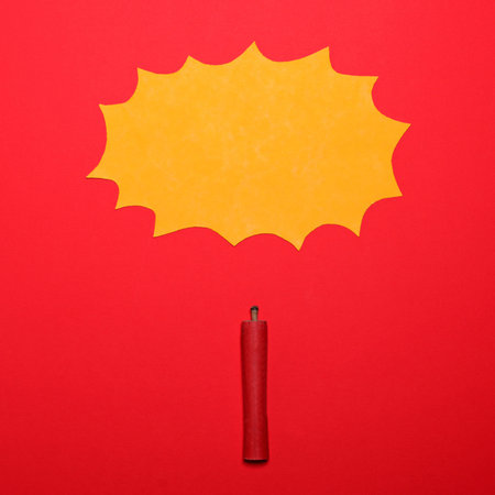 Dynamite stick with empty yellow cloud sign above on red background - Explosion concept - Minimal designの写真素材