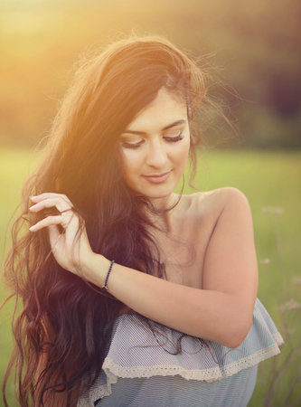 Portrait of beautiful young woman in nature