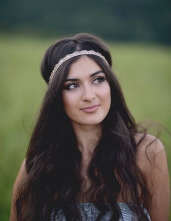 Portrait of beautiful young woman in natureの写真素材