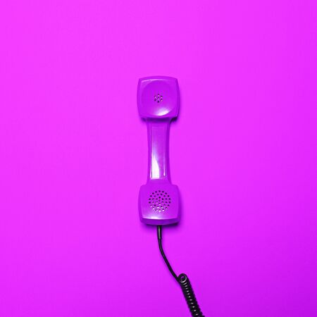 Retro purple telephone tube on pink background - Minimal designの写真素材