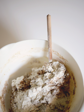 Home made bread preparation - Top view of freshly made dough in mixing bowlの写真素材