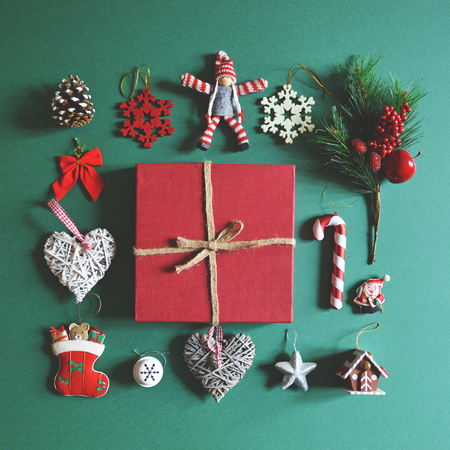 Flat lay of Christmas decoration and ornaments on green background - Trendy minimal flat lay designの写真素材