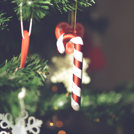 Christmas decoration and ornaments hanging from Christmas tree - New year or Christmas conceptの写真素材
