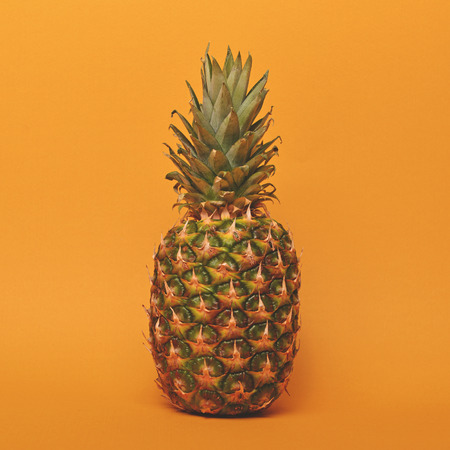 Pineapple against yellow mat background  - Trendy minimal designの写真素材
