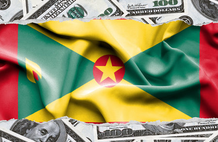 Financial concept with banknotes of US currency around national flag of Guernseyの写真素材