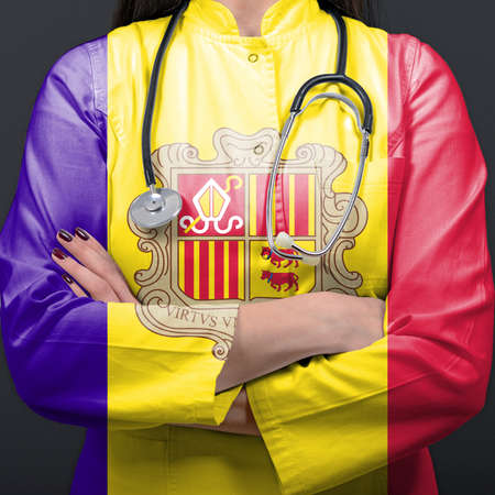 Doctor representing healthcare system with National flag of Andorraの写真素材