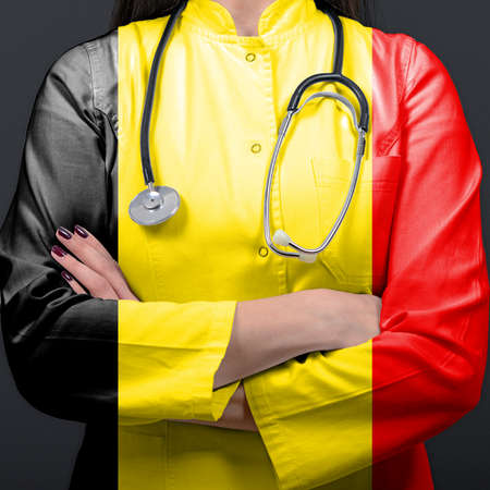 Doctor representing healthcare system with National flag of Belgiumの写真素材