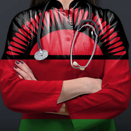 Doctor representing healthcare system with National flag of Malawiの写真素材