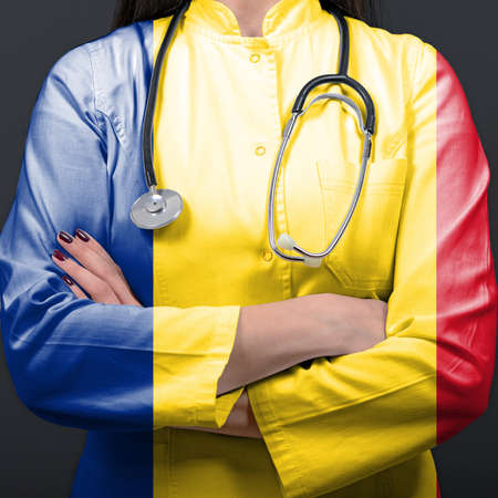 Doctor representing healthcare system with National flag of Romaniaの写真素材