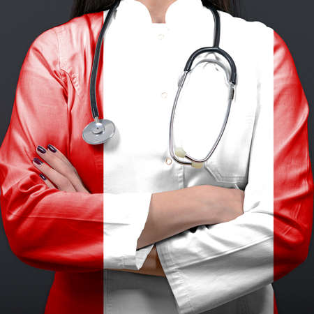 Doctor representing healthcare system with National flag of Peruの写真素材