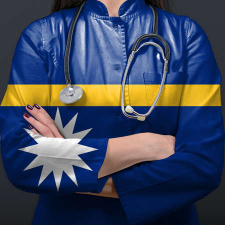 Doctor representing healthcare system with National flag of Nauruの写真素材