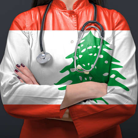 Doctor representing healthcare system with National flag of Lebanonの写真素材