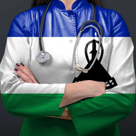 Doctor representing healthcare system with National flag of Lesothoの写真素材