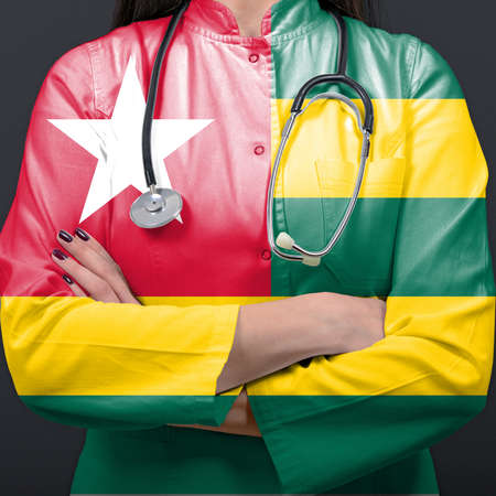 Doctor representing healthcare system with National flag of Togoの写真素材