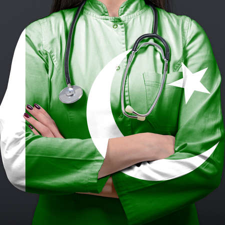 Doctor representing healthcare system with National flag of Pakistanの写真素材