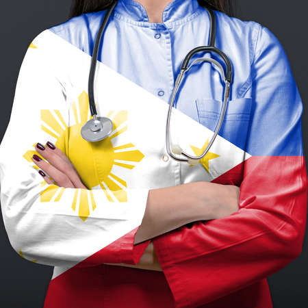 Doctor representing healthcare system with National flag of Philippinesの写真素材