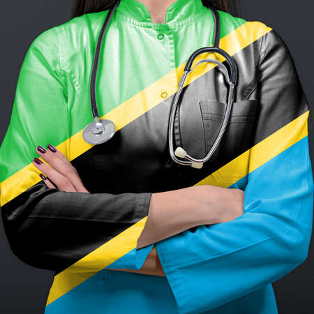 Doctor representing healthcare system with National flag of Tanzaniaの写真素材