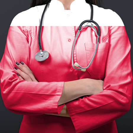Doctor representing healthcare system with National flag of Polandの写真素材