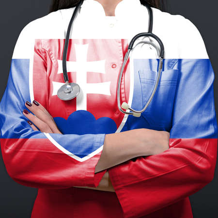 Doctor representing healthcare system with National flag of Slovakiaの写真素材