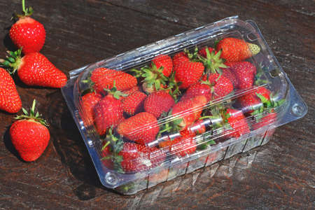 Fresh strawberries on wooden tableの写真素材