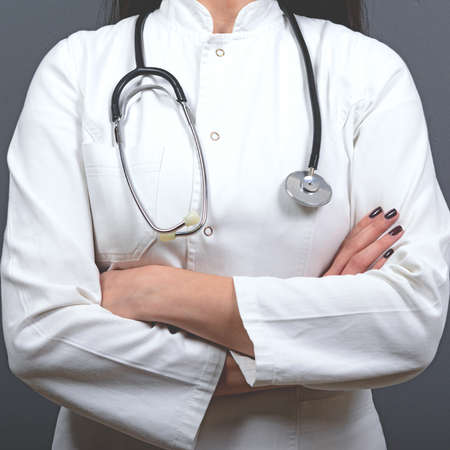 Closeup of woman doctor against gray background - Doctor Conceptの写真素材