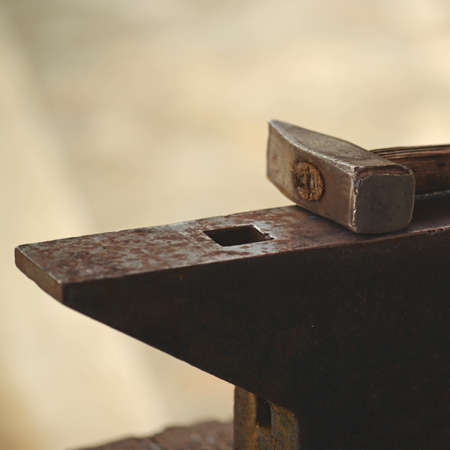 Hammer and anvil close up shotの写真素材