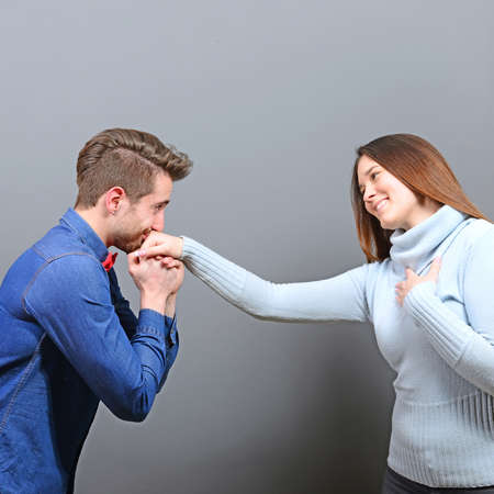 Man kissing womans hand as a gentlemanの写真素材