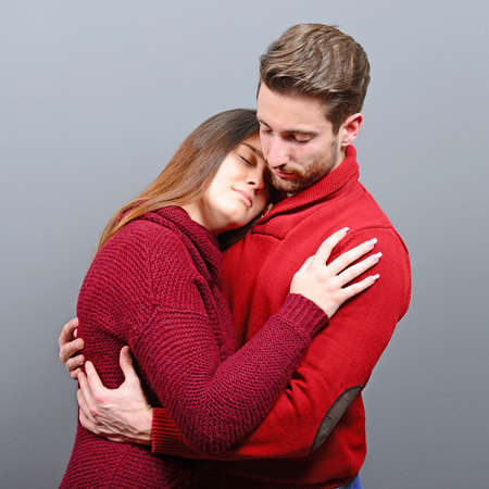 Two young people sharing roamance and huggingの写真素材