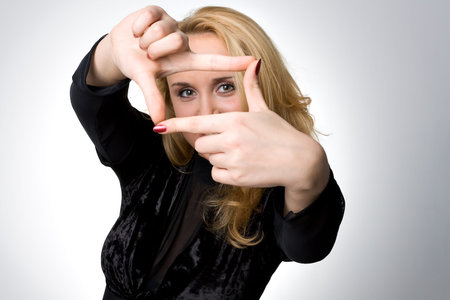 Portrait of a Girl with sign of frame on greyの写真素材