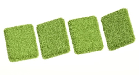 3d green grass tablets on white backgroundの写真素材