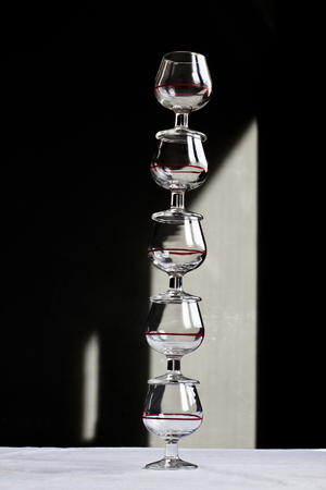 Stacked glasses and shadowsの写真素材